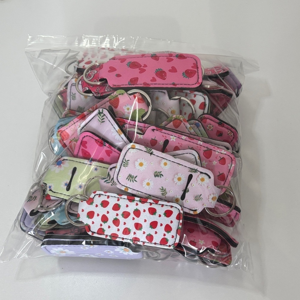 Mystery Colorful Strawberry and Floral Lip Balm Holder Keychain Set